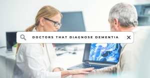 A female doctor discussing brain scans with an elderly male patient at a computer, with a search bar overlay reading "doctors that diagnose dementia." Symbolizing the topic of the blog 3 Doctors that Diagnose Dementia