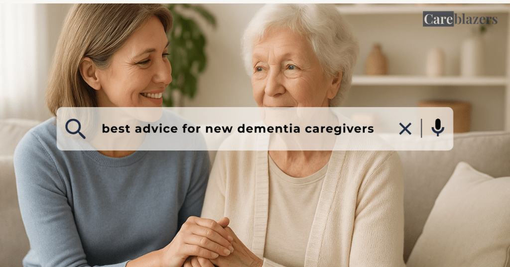 Middle-aged daughter holding her elderly mother’s hand on the sofa, showing love and support, symbolizing the best advice for new dementia caregivers.
