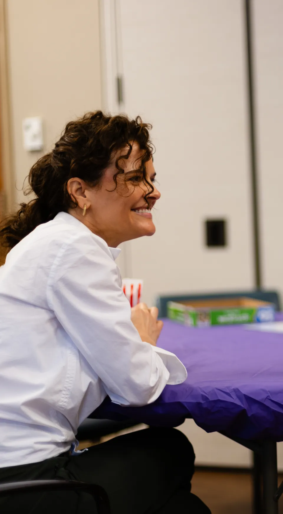 Dr. Natali Edmonds listening closely to a caregiver at a respite day