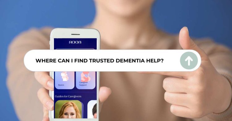 Dementia Caregiver using Roon app on smartphone to find dementia care help, with callout asking 'Where can I find trusted dementia care help?